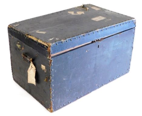 A Victorian black leather bound travel trunk, with a pair of cast iron carrying handles, bearing labels, for GWR, Great North