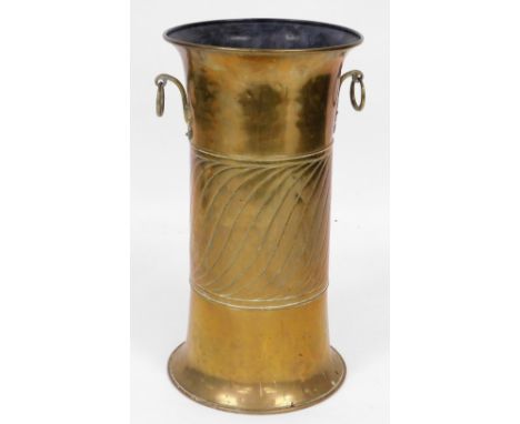 A Victorian Arts and Crafts brass twin handled stick and umbrella stand, with a spiral engraved central band, 60cm high. 