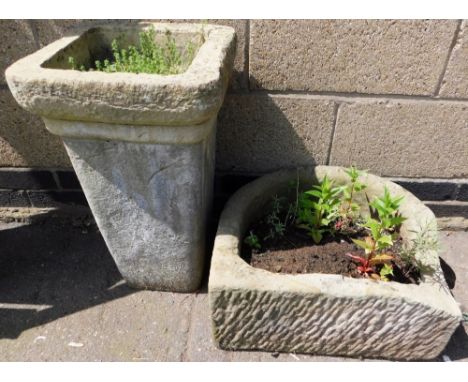 A composition plant pot, of square tapering form, 56cm high, together with a planter trough, 50cm wide.