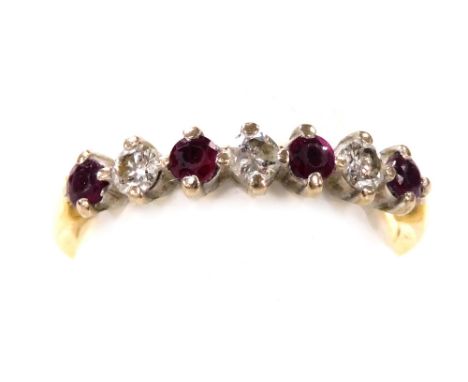 An 18ct gold ruby and diamond seven stone ring, size N, 2.6g.