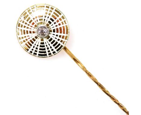 A circular white enamel tie pin, formed as a spider's web, with a central old cut diamond, in yellow metal, stamped 18, 2.9g.