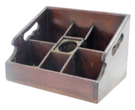 A Victorian mahogany caddy or housekeeper's box, with seven tiered compartments, 25.5cm wide. 