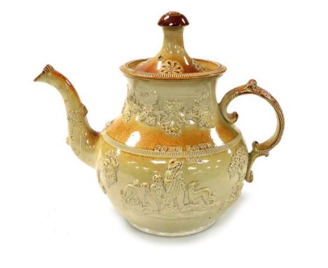 A mid 19thC cream and buff stoneware tea kettle and cover, sprig moulded with hunting figures, cornucopias of fruit and vines