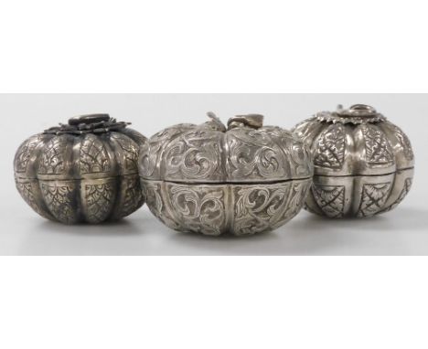 Three Indian white metal trinket boxes, each in the form of a pumpkin or other squash type fruit, of differing designs, the l