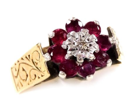 A 9ct gold ruby and diamond flower head ring, high claw set, size L, 3.6g.