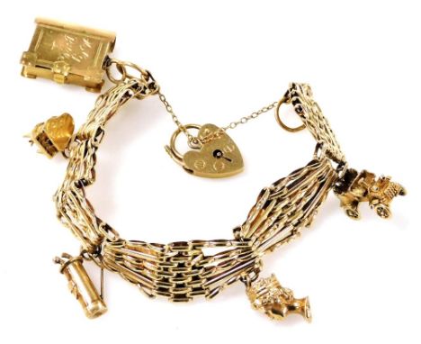 A 9ct gold gate charm bracelet, with five charms as fitted, on a heart shaped padlock clasp, with safety chain as fitted, 28.