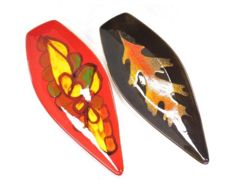 A Poole pottery Aegean dish, shape number 82, decorated with a leaf against a brown ground, together with a Delphis dish, sha