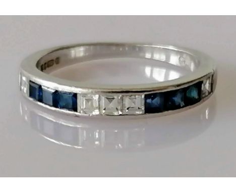 An 18ct white gold half-hoop sapphire and diamond eternity ring, channel-set with six square-cut sapphires alternating with f