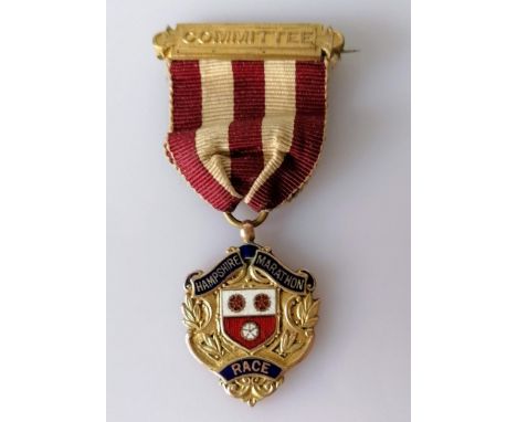 An Edwardian gold medal relating to the Hampshire Marathon Race, 1908, presented to D. K. Whitlock, hallmarked for M Emanuel,