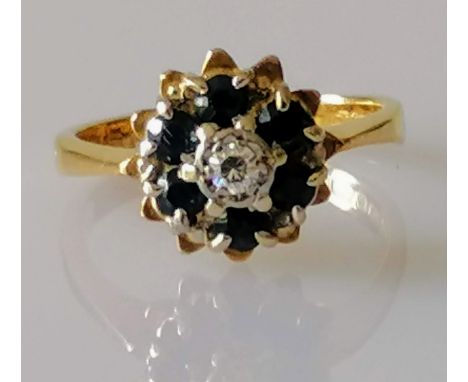 A 18ct gold diamond and sapphire flower ring, size I, hallmarked, 3.55g