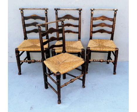 A harlequin set of four early 19th century ash and elm Macclesfield dining chairs with ladder backs, rush seats, on turned le