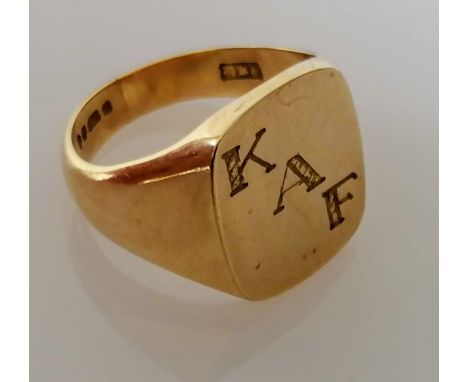 A 9ct yellow gold signet ring, initialled, size T, hallmarked, 10.9g