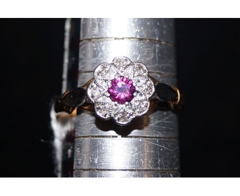 18ct Gold &amp; platinum ring set with central ruby &amp; surrounding diamonds Size O 