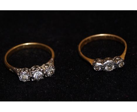 x2 Yellow metal tested for high carat gold 3 stone diamond rings 