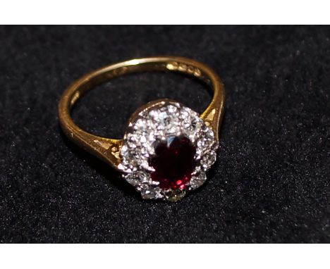 18 carat gold ring set with diamonds and central ruby, size K 1/2, 3.5 3.5 grams 