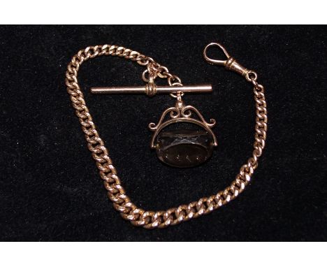 9 carat rose gold Albert chain (each link stamped) with T bar, dog clip and swivel fob smokey quartz, overall weight 23.6 gra