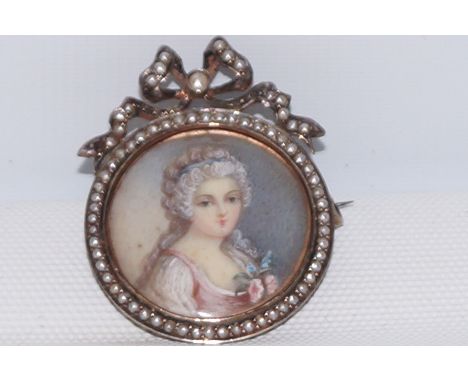 Late 18th/ early 19th century portrait miniature brooch in silver gilt frame set with seed pearls 