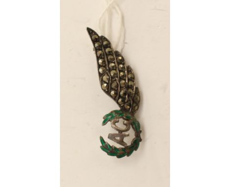 WW2 RAF Air Gunners Sweetheart Wing Brooch. Silver with wreath picked out in green enamel. Paste stones set in the wing. 40mm