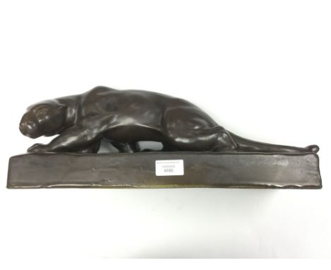 An Art Deco figure of a stalking Panther  Bronze effect ceramic. Tail of cat has old glue repair a/f. Length 43cm, height 18c