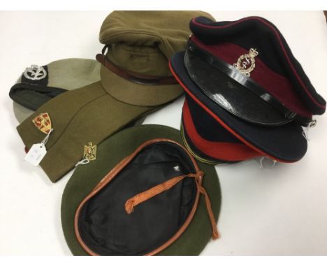 A collection of six post war caps: British Full Dress OR's cap with slashed Peak dated 1965, no cap badge: RAMC full dress OR