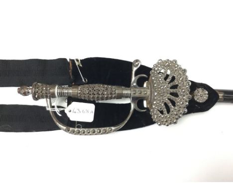 Victorian Dress Sword. Ornate grip and Clamshell guard decorated in steel with polished imitation stones. 78cm blade three si