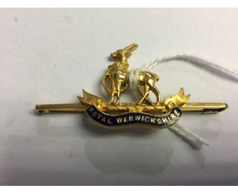 WW1 British 9ct Gold Royal Warwickshire Regiment brooch with blue enamel detail. Pinbacked. 50mm long. 