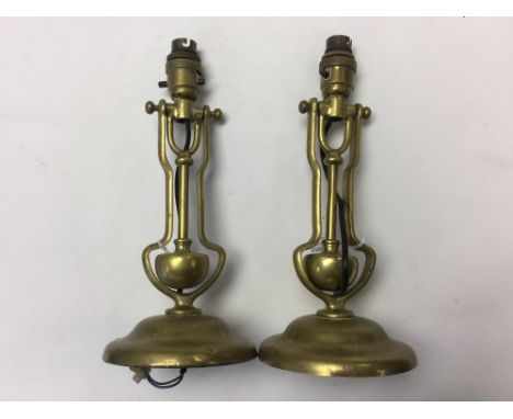 A pair of early circa 1920 brass maritime weighted wall electric light fittings (2)