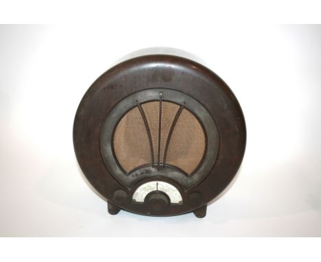 EKCO TYPE 75 BAKELITE RADIO a circular shaped Radio with paper dial (dial with some damage). Marked, Ekco Type AD75 Receiver,