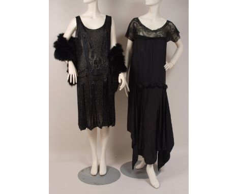 TWO 1920'S EVENING DRESSES A black beaded flapper dress embroidered throughout with black bugle beads and sequins on a fine c