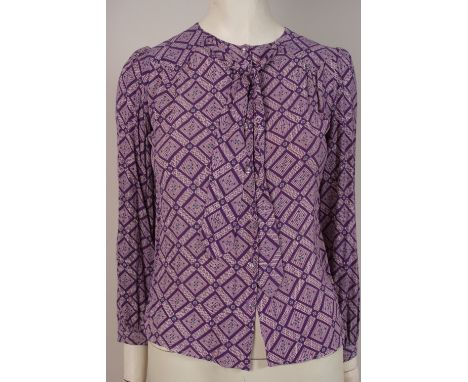 A 1970'S 'CLOBBER' SILK PRINT BLOUSE Pretty mauve geometric print silk blouse designed by 'Jeff Banks'. Tie front at the neck