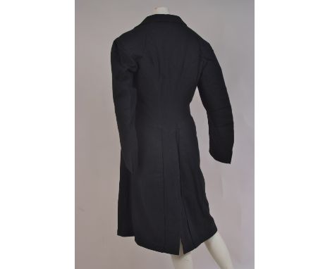 A CIRCA 1900 GENTLEMAN'S FROCK COAT & WAISTCOAT A woollen frock coat, double breasted with original fabric covered buttons, s