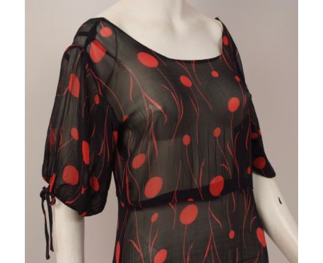 TWO 1930'S CHIFFON TEA DRESSES A black sheer crepe, horizontally pin-tucked down the body to a drop waist line. The back is s