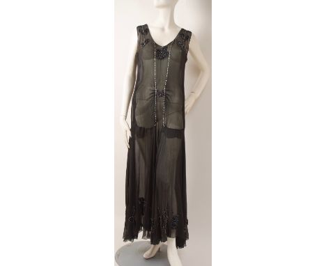 A 1930'S BLACK SILK & DIAMANTE EVENING DRESS Sheer black silk falling to a drop waist with lines of diamante and appliqued le