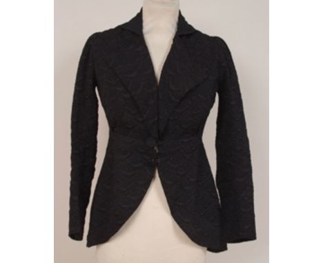 A VICTORIAN BLACK SILK JACQUARD RIDING JACKET Beautifully tailored from a fine jacquard brocade black satin. Fastened at the 