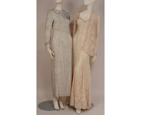 A 1960'S LACE DRESS AND SILVER BEADED DRESS. A cream machined lace dress, fitted bodice falling into folds. Spaghetti straps,