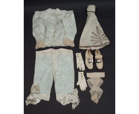 A PERIOD SILK PAGE BOY'S OUTFIT Light blue satin silk trousers, shirt and cape, with white gloves and buckled shoes. Good con