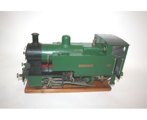 MODEL STEAM LOCOMOTIVE - 3 1/2" GAUGE a static 3 1/2" gauge model steam tank locomotive, 0-2-2-0 Karola. On a wooden block, 5