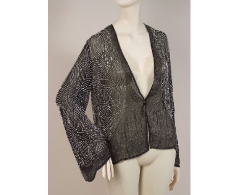 A VINTAGE BEADED EVENING JACKET Fine chiffon ground with black and silver bugle beads running in an arabesque design. There i