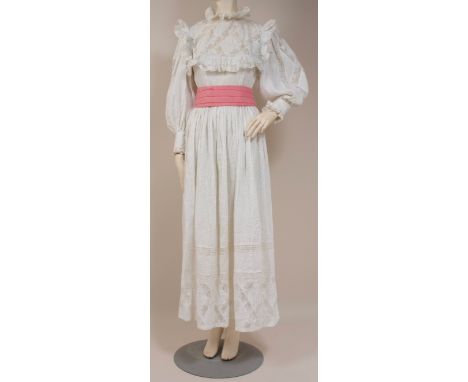 A 1971 WHITE 'MEXICANA'  WEDDING DRESS Pin-tucked white cotton dress with lace insets, high lace collar, long puffed lace and