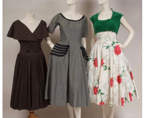 THREE 1950'S DAY DRESSES A pretty cotton rose print dress with full circle skirt, ruched bust, fitted waist band with green v