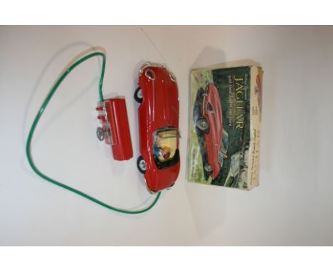 LOUIS MARX BOXED JAGUAR a battery operated remote control Jaguar Car, with forward and reverse gears, light and horn. In it's