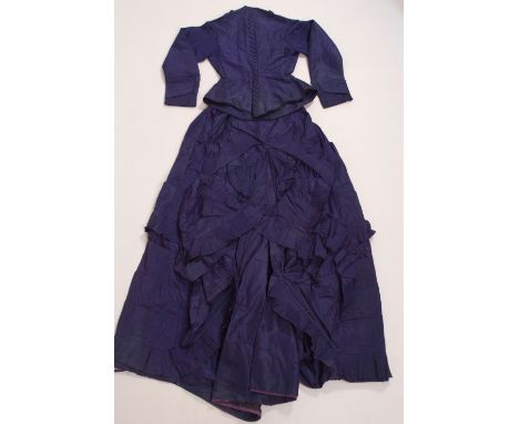 A CIRCA '1867' VICTORIAN TWO PIECE SILK BUSTLE DRESS Heavy dark blue taffeta silk two piece costume, hand sewn tailored jacke