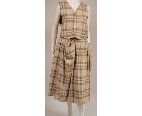 A 1970'S 'JUNGLE JAP' SKIRT/WAISTCOAT A 100% brush cotton plaid skirt and waistcoat.  The skirt fastens at the front with zip