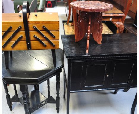 An octagonal ebonised hall table, a carved Oriental style stool, a mid 20th century black painted side cupboard on shaped leg