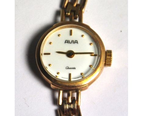A 9ct gold ladies Avia quartz wristwatch, enamel dial set with baton and dot gilt numerals on a 9ct gold strap, approx weight