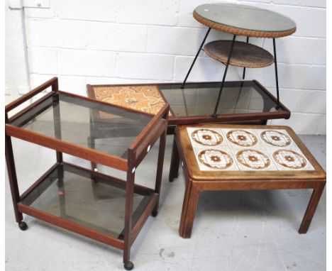 Two retro tile topped coffee tables, a tea trolley and a wicker occasional table with lower tier, raised on four metal suppor