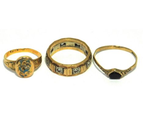 A yellow metal ring marked 18ct, a yellow metal ring with blue enamel decoration and floral design of white stones (some miss