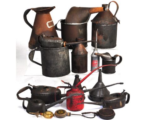 A quantity of vintage motor mechanics oil cans.