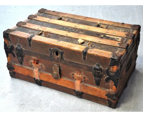 A late 19th century cloth and strap bound rectangular trunk with twin carrying handles, length 72cm. *Used by the vendor's gr