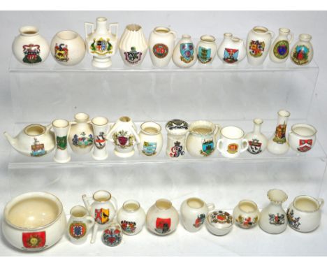 Approximately thirty pieces of Crested ware to include examples by W.H. Goss and Arcadian china.